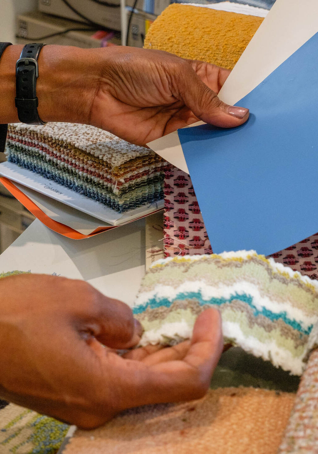 68eeea7feee82_Freda's hands with paint color cards in one and fabrics in the other